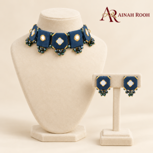 navy choker and earrings on ivory velvet